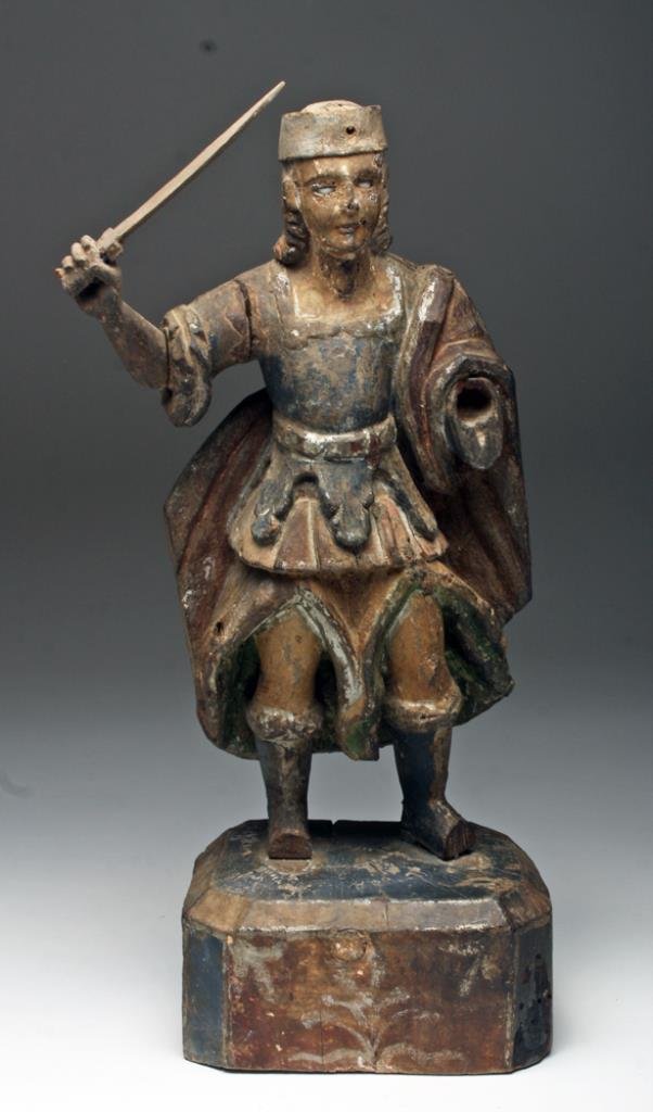 18th C. Mexican Santos - San Miguel: Mexico, ca 18th century CE. Carved wood figure representing the Archangel San Miguel (Saint Michael). San Miguel stands ready to battle Satan, long sword in his right hand determined facial expression