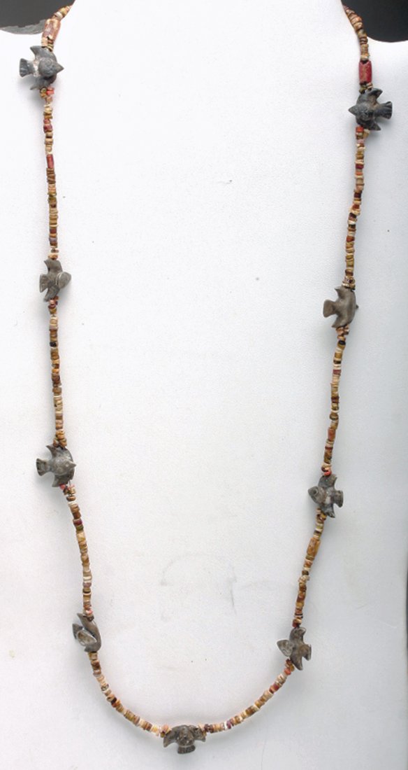 Chimu Inca Silver Birds and Stone Necklace: Pre-Columbian, northern Peru, Ca 1100 to 1300 CE. Stunning and wearable necklace comprised of 9 solid silver birds along with hundreds of small ancient stone beads mostly in shades of brown and tan. T