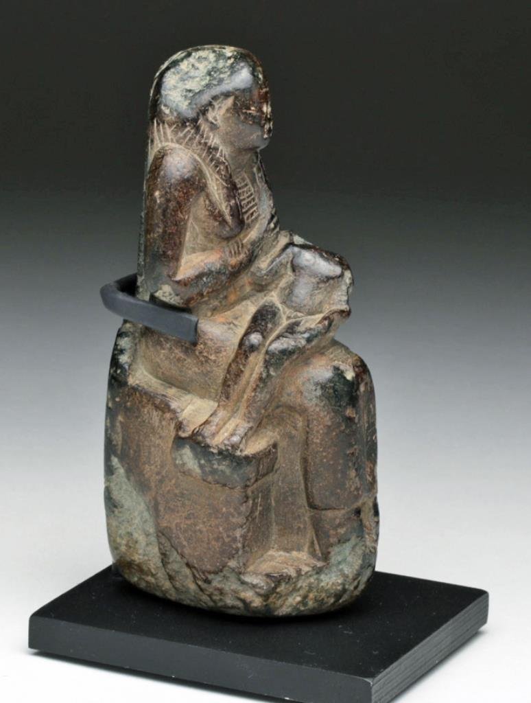 Egyptian Steatite Isis and Horus Sculpture: Egypt, Late Dynastic Period, Ca 700 to 330 BCE. Carved stone sculpture of Isis suckling Horus, as the child god sits upon her lap. Nice details in her pectoral and long braided hair. 3-7/8" H, not inc