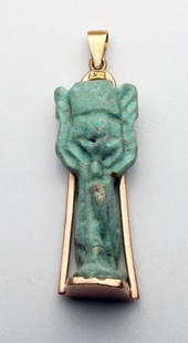 Egyptian Faience Amulet of Shu, 14k Rose Gold Pendant: Egypt, Late Dynastic Period, Ca 715 to 330 BCE. Large faience amulet in the form of Shu - holding up the sun. Drilled for suspension in reverse. Amulet set in 14kt rose gold with pendant bale. 