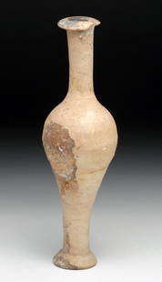 Greek Terracotta Spindle Jar: Magna Grecia, Ca 4th century BCE. Tall thin pottery unguent jar in spindle form. Flared rim and foot, with remains of added black around rim. Classic example! 6-1/2" H. Provenance: Ex-Pearson