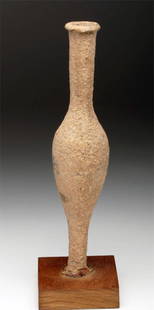 Tall Greek Pottery Spindle Jar: Magna Graecia, Ca 4th century BCE. Tall thin pottery unguent jar in spindle form. Flared rim and foot, with deep encrusted surface from 2000+ years of burial. Classic example! 8-1/2" H. 