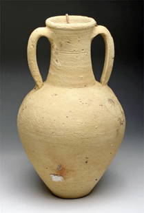 Hellenistic Greek Pottery Storage Jar: Southern Italy, probably Canosa region, Ca 3rd to 2nd century BCE. Nice large pottery jar with long thin neck, twin strap handles, exterior in unusual light yellow, with nice sea encrustations on