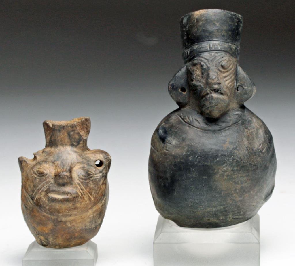 Lot of 2 Miniature Chimu Vessels: Pre-Columbian. Peru, ca. 1100 - 1450 CE. Set of two charming terracotta vessels designed to be worn. The first brownware face vessel with perforated handles / ears (top of one missing, along with rim 