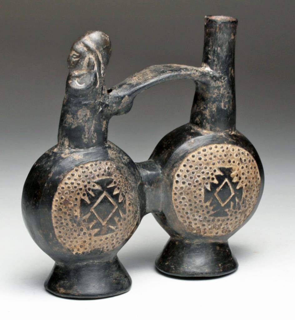 Inca Post Colonial Blackware Whistling Jar: Northern Peru, Ca 16th century. Pottery blackware jar in twin lobes, both impressed on the sides with Inca cross, small human sits upon one lobe, whistle emerging from his back, spout on other lobe ac