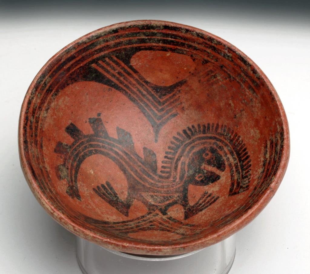 Pre-Columbian Cocle Bi-Chrome Bowl: Panama, ca. 800 - 1000 CE. Redware pottery shallow bowl with scene in tondo of a mythological creature. Nice fineline details. Exterior plain. 4-3/4" diameter x 1-5/8"H. Provenance: Ex-F. Mitchell Col