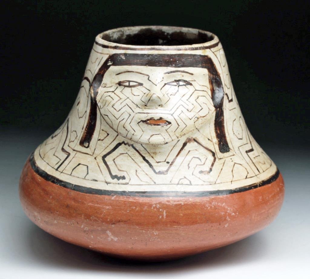 Amazonian Shapibo Polychrome Olla: Amazon River Valley, Peru, Ca 1950 to 1970. Decorated pottery bowl from the Shipibo-Conibo tribe, an indigenous people along the Ucayali River in the Amazon rainforest in Peru. Olla with single face, 