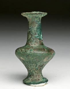 Egyptian Bronze Kohl Vessel, ex- Barakat: Egypt, Middle Kingdom to Third Intermediate Period, Ca 1803 to 1000 BCE. Fine bronze kohl vessel with flared foot and rim and bulbous midsection, delicately incised floral decoration on shoulder,