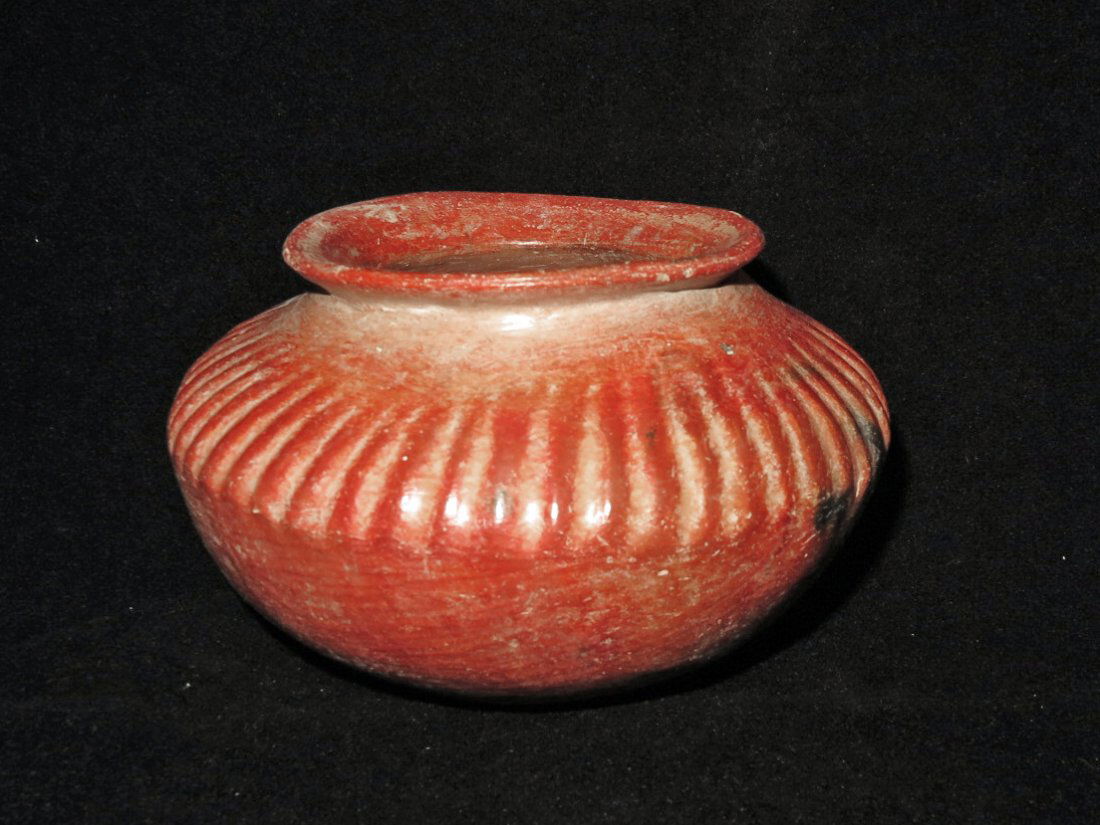 Pre-Columbian Colima Melon Bowl: Colima, W. Mexico, Ca 300 BCE to 300 CE. Redware jar with multiple raised ribs. 6 1/2" wide. Provenance: Ex-Lynn Langdon collection acquired in the 1950's. All items legal to buy/sell under U.S. Statu