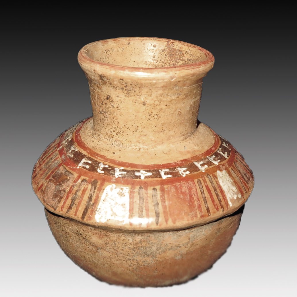Jalisco Pre-Columbian Polychrome Jar: Jalisco, W. Mexico, ca 300 BCE to 300 CE. Cute painted jar with rounded base, a faux-lid and flared rim, lid section painted in red, white and brown over the cream base. 5" tall. Provenance: Ex-Lynn L