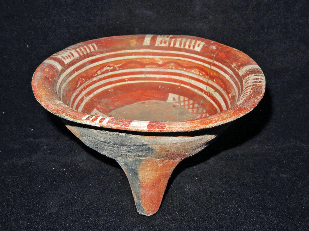 Pre-Columbian Tripod Grater Bowl: Jalisco, W. Mexico, Ca 300 BCE to 300 CE. Interesting tripod grater bowl liberally decorated on the interior with red and white pigment. 8 3/4" wide Provenance: Ex-Lynn Langdon collection acquired in