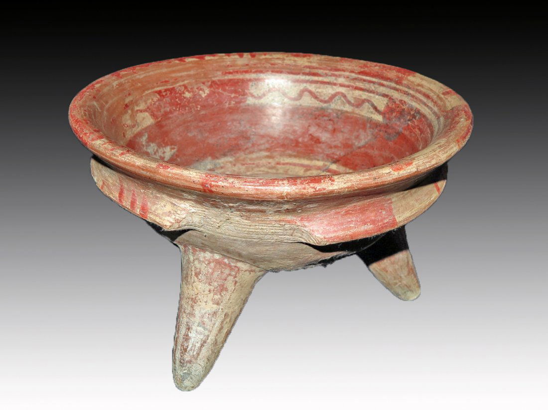 Pre-Columbian Tarascan Tripod Grater Bowl: Tarascan, Mexico, Ca 1000 to 1500 CE. Tripod bowl with grater built into base, set of three wings molded beneath, painted in bold geometric pattern. 8 1/2" wide, large, Provenance: Ex-Lynn Langdon col