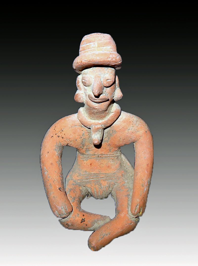 Pre-Columbian Colima Flat Figure with Hands on Knees: Colima, W. Mexico, Ca 300 BCE to 300 CE. Pottery flat depicting a seated male, his hands rest on his knees, he wears a large pectoral, headdress and loin cloth. 4 1/8" tall, Provenance: Ex-Lynn Langdo