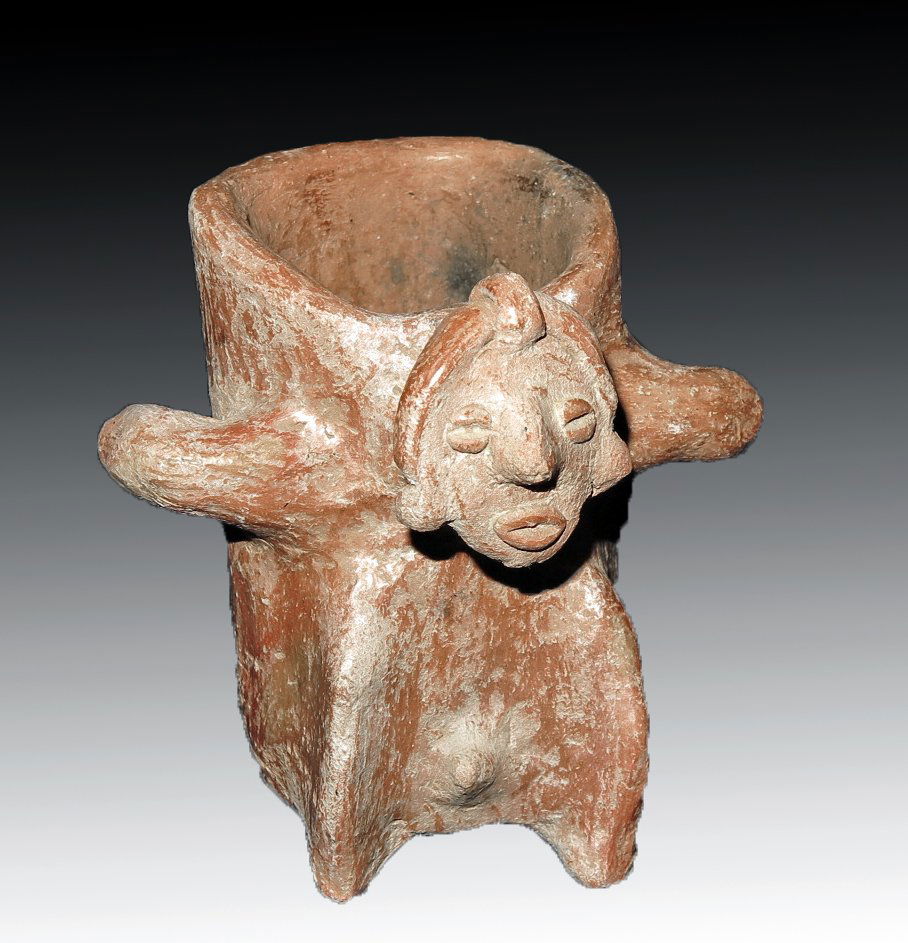 Pre-Columbian Colima Seated Male Jar: Colima, W. Mexico, Ca 300 BCE to 300 CE. Pottery jar in redware with human male emerging from one side, with coffee bean eyes, arms wrapped around the reverse showing he is holding this large load on