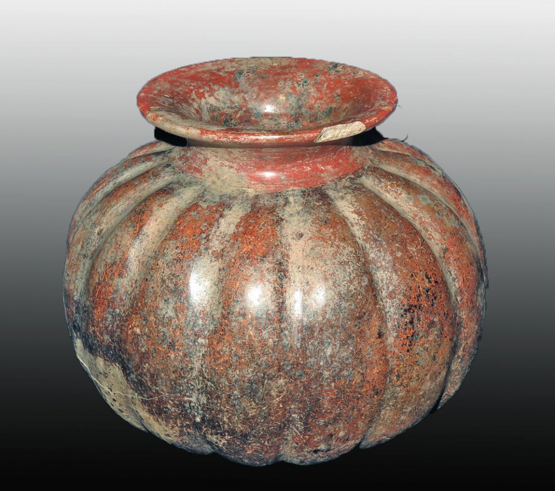 Pre-Columbian Colima Redware Melon Jar: Colima, W. Mexico, Ca 300 BCE to 300 CE. Fine melon bowl in deep red/brown slip, flared rim and extensive manganese blooms. 8" wide Provenance: Ex-Lynn Langdon collection acquired in the 1950's. All i