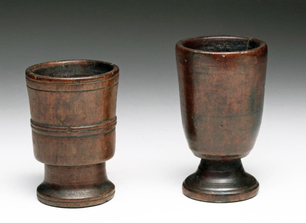 Lot of 2 Inca Post Conquest Wood Keros: Peru, Ca 16th to 17th centuries. Nice pair of wooden keros used for drinking fermented corn beer - chicha. These were made using a lathe, so obviously they were manufactured after the Spanish had conq
