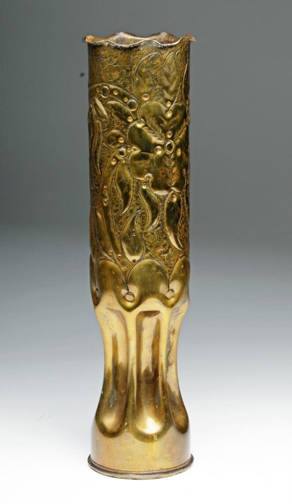 WWII Brass 75mm Shell Trench Art: US, Ca 1942 to 1945, unsure whether Pacific or European Theater. Decorated 75mm shell, with fluted lower 1/3rd and floral pattern above extending to scalloped rim. If you can imagine sitting in a tren