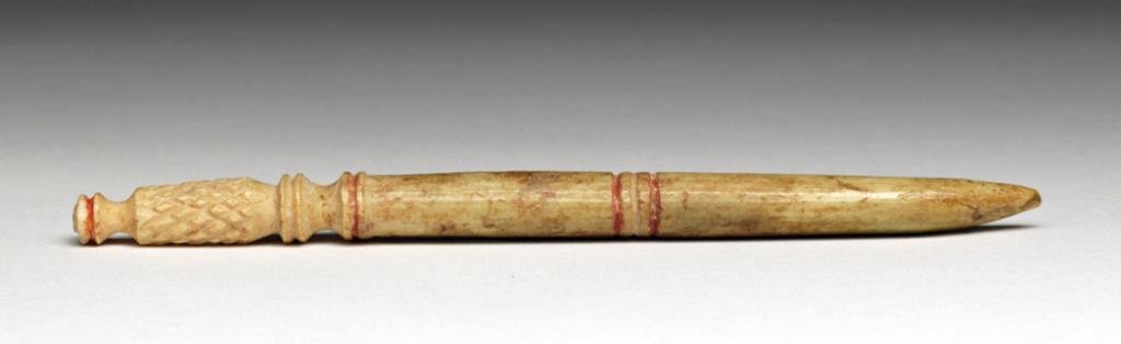 Rare Romano Egyptian Bone Stylus: Egypt, Roman Period, CA 100 BCE to 200 CE. We debated whether this is a stylus or hairpin, but the distinct pattern of use at the sharp end makes us lean heavily toward stylus. Carved pin with series