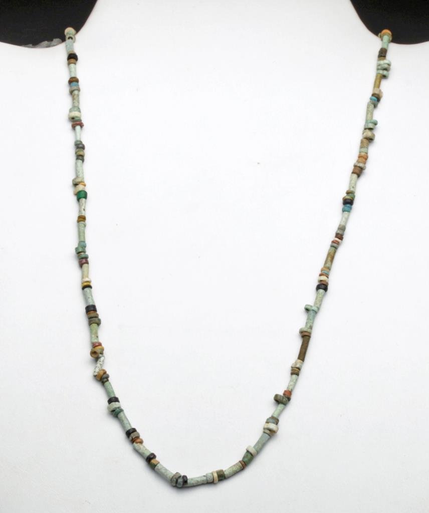 Egyptian Faience Necklace, ex-Barakat: Egypt, New Kingdom to Late Dynastic Period, Ca 1300 to 600 BCE. If you're like most people, a necklace like this may be the only thing you could afford at Barakat... Assorted ancient faience beads in