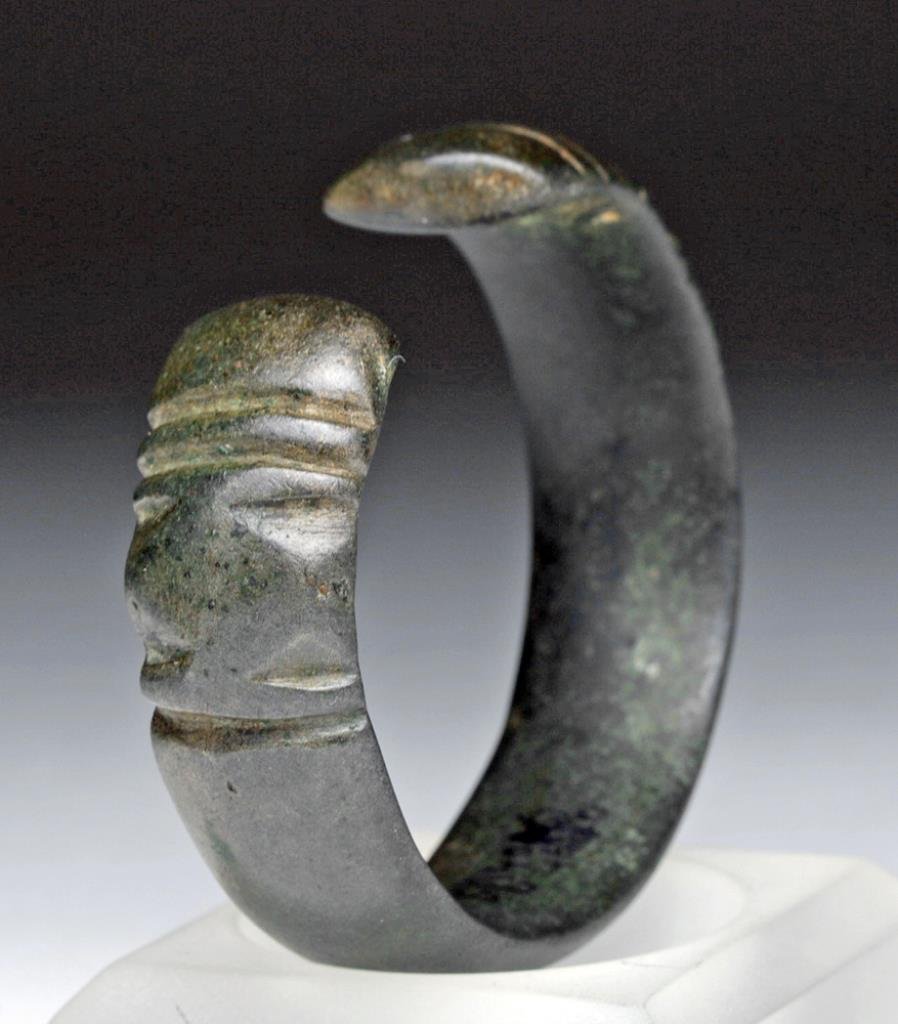 Wearable Woman's Khmer Bronze Bracelet: Cambodia, Ca 1st millennium CE. Stunning ancient patina! Small woman's or child's bronze bracelet. Heavy cast bronze rounded profile with cold-worked decorations at each end. 2-1/4" inner diameter. Pr