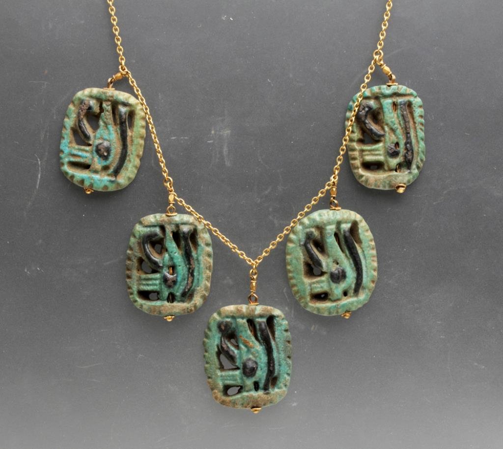 Egyptian Necklace - 5 Eye of Horus Faience Amulets: Egypt, Third Intermediate Period to Late Dynastic, Dynasties 21 through 26, Ca 1000 to 525 BCE. Goldtone chain (not marked, but believe to be 14K gold) from which five Eye of Horus (Udjat) faience amu