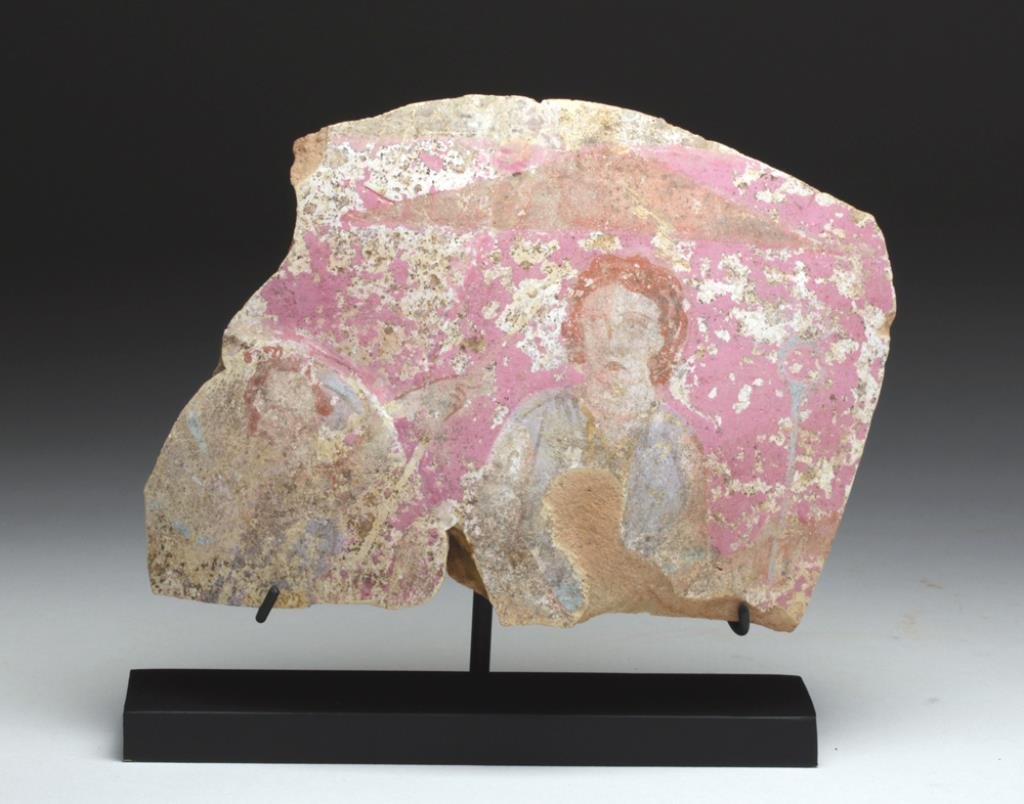 Canosan Pottery Fragment - Wonderful Coloration: Southern Italy, Canosa, Ca 4th century BCE. Section from a large amphora or krater, decorated with female and man-wielding a shield, colored in bright pink, blues, browns and white. One can only imagi