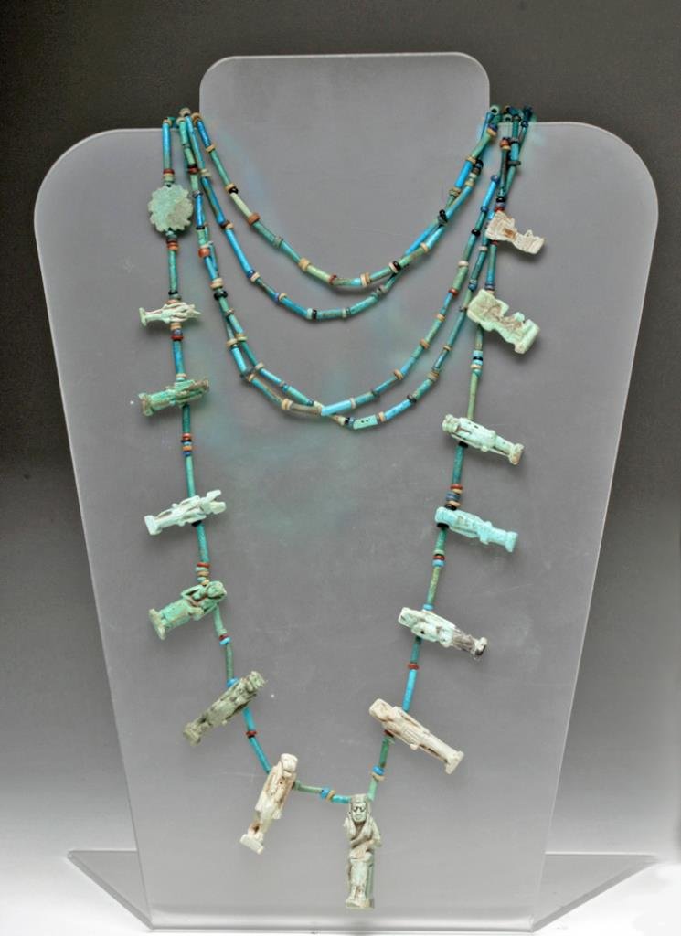 Egyptian Faience 5 Strand Necklace w/ Amulets +: Egypt, New Kingdom through Late Dynastic, Dynasties 18 through 26, Ca 1500 to 500 BCE. Stunning and wearable faience necklace comprised of 5 strands of blue faience tubular beads strung among small br