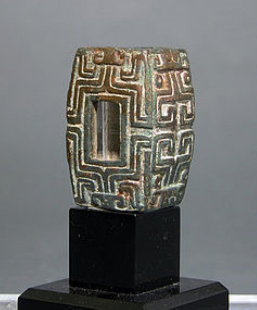 Chinese Bronze Adornment with Taotie Motifs - Zhou: China, Zhou Dynasty, ca. 1122-256 BCE. A striking piece of ancient art! Cast bronze decorative adornment with Taotie motifs on each of four sides (monster mask commonly found on ancient Chinese ritual
