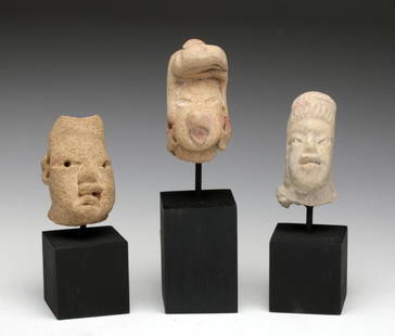 Pre-Columbian Olmecoid Terracotta Heads (3): Pre-Columbian, Southern Mexico to Guatemala, Olmecoid, ca. 1000-800 BCE. Fine trio of ceramic heads, each one captivating in its own right. Nice representatives of Olmec babies with characteristic