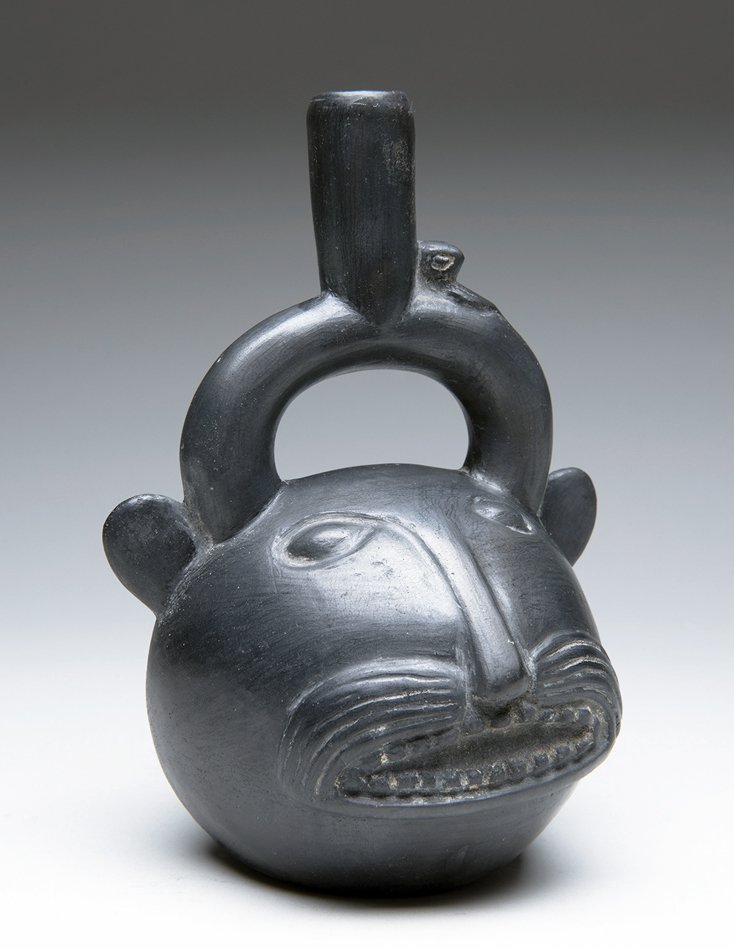 Inca Stirrup Vessel, Smiling Jaguar, Ex-Hollywood: Pre-Columbian, Peru, Inca culture, Ca 1400 to 1500 CE. Choice and most attractive pottery stirrup vessel in the form of a smiling jaguar. Open mouth with toothy smile, rounded ears to the sides of the