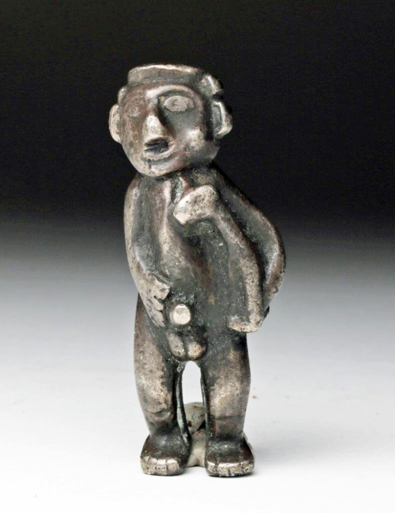 Inca Silver Figure, Hunchback Male with Baby Llama: Pre-Columbian, Peru, Inca culture, ca. 1300-1500 CE. Unusual sculptural depiction of a male hunchback figure holding a baby llama under one arm, and yes, himself, with the other hand. Look closely at 