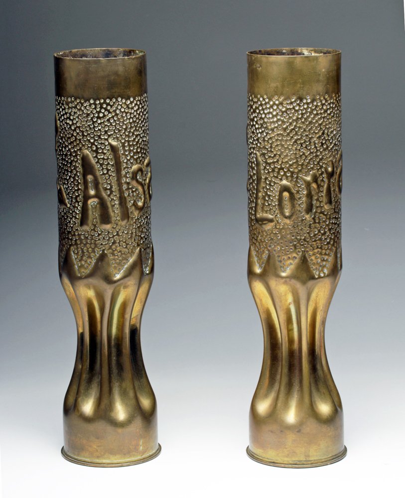 Pr. WWI Trench Art Shells - Alsace Lorraine: Europe , during The Great War - 1914-1918. Two large 75 mm artillery shells converted from weapons to art. Finely decorated, one reading "Alsace", the other "Lorraine" - both with a lovely rendering o