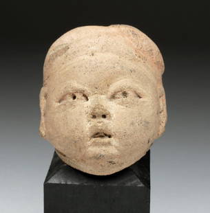 Pre-Columbian Olmec Baby Head: Pre-Columbian, Mexico, Olmec culture, 12th - 9th c. BCE. One of the finest examples of an Olmec baby face we have seen! Boasts characteristically downturned mouth, almond-shaped eyes with