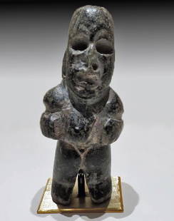 Olmec Stone Hunchback Figure: Pre-Columbian, Mexico, Olmec culture, ca. 1100 - 550 BCE. The ancients of Mesoamerica seemed to relish in their representations of hunchbacks. The fine workmanship evident in this piece and others