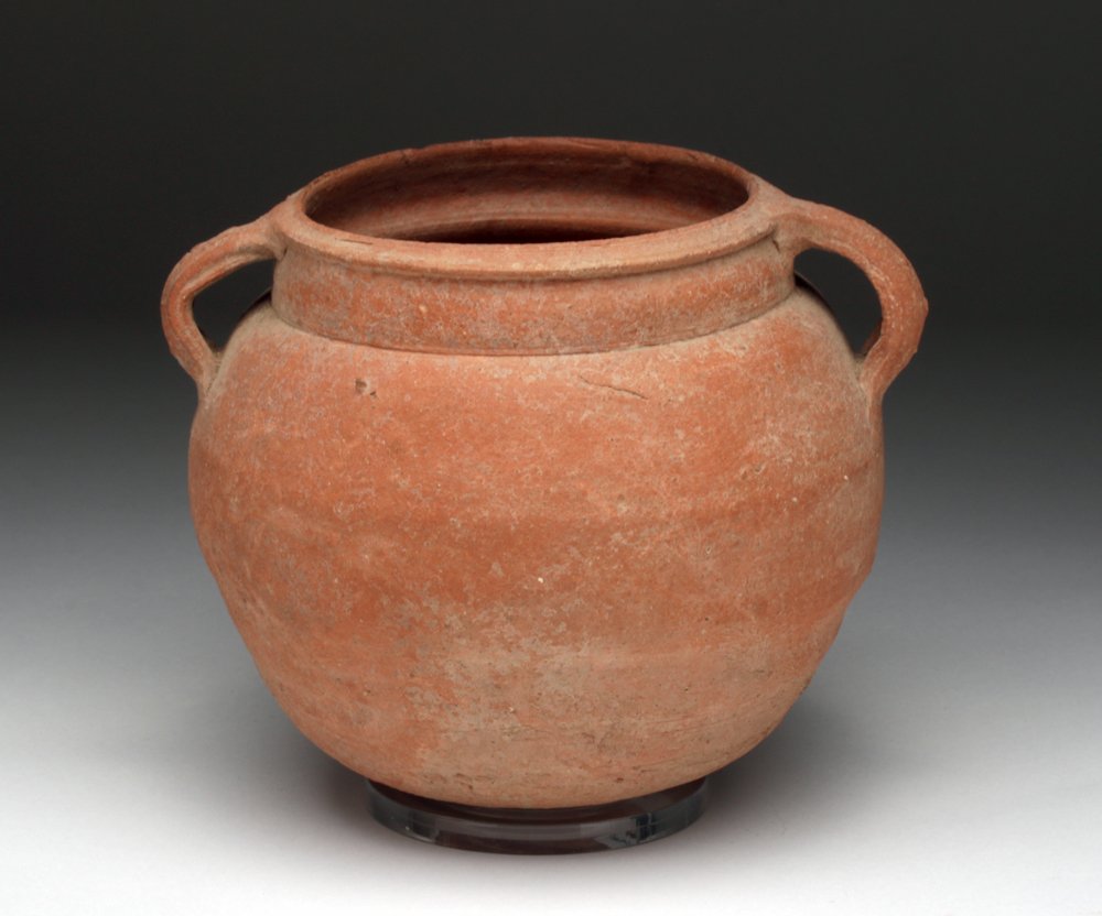 Roman Redware Twin-Handled Jar: Roman Empire, Ca 2nd century CE, found near Pergamum, Turkey. A very fine pottery redware pot, wheel thrown with conical bottom, straight short neck and small sloping rim. Twin handles adorn the sides
