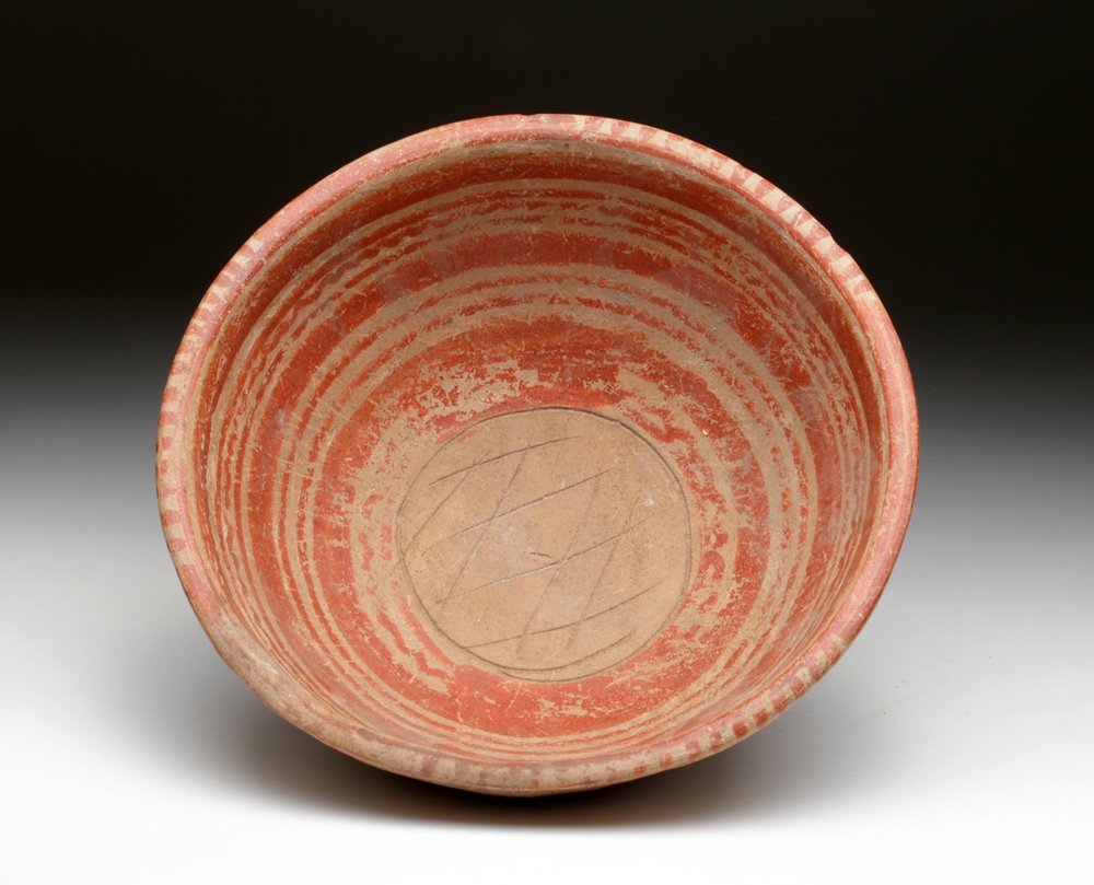 Michoacan Grater Bowl - Linear / Wave-like: Pre-Columbian, West Mexico, Michoacan, ca. 300 BCE - 300 CE. Nice Michoacan grater bowl painted in red on terracotta ground with elegant linear and wave-like markings. Incised cross-hatching in the ce