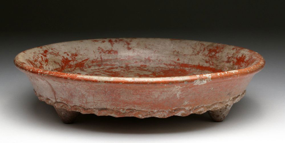 Chupicuaro Tripod Shallow Bowl: Pre-Columbian, Western Mexico, Guanajuato River Valley, ca. 300 to 100 BCE. Nice piece of Chupicuaro redware. A shallow bowl resting on three conical feet with nice scalloped detail along bottom edge.