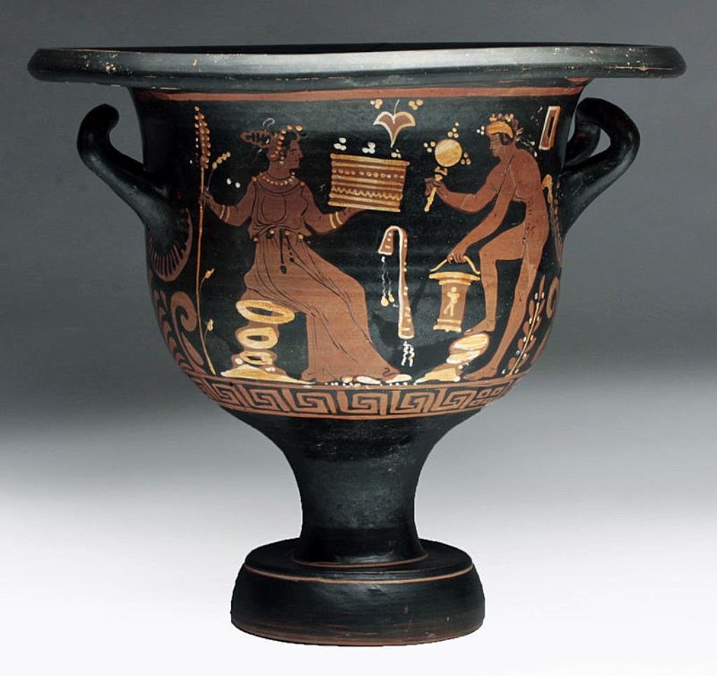 Published Greek Apulian Bell Krater, ex-Bonham's: Magna Graecia, Southern Italy, Apulia, ca. 4th century BCE. A magnificent red figure bell krater, depicting on side (A) a maenad seated on a pile of rocks, holding a thyrsus and casket, facing a nude 
