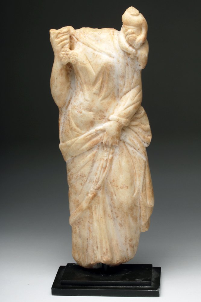 Roman Marble Statuette of Fortuna: Rome, Ca. 1st-2nd Century CE. Marble figure of the Roman Goddess who is equated with the Greek goddess Tyche, an ancient goddess of the Italic peninsula. Her name means "fortune" and she is associated