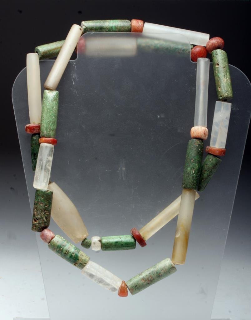 Tairona Necklace - Carnelian, Agate, Quartz, Green: Pre-Columbian, Columbia, South America, Tairona culture, ca. 800-1000 CE. This necklace is comprised of thirty-seven ancient Tairona carnelian, agate, quartz crystal, and greenstone beads with one mod