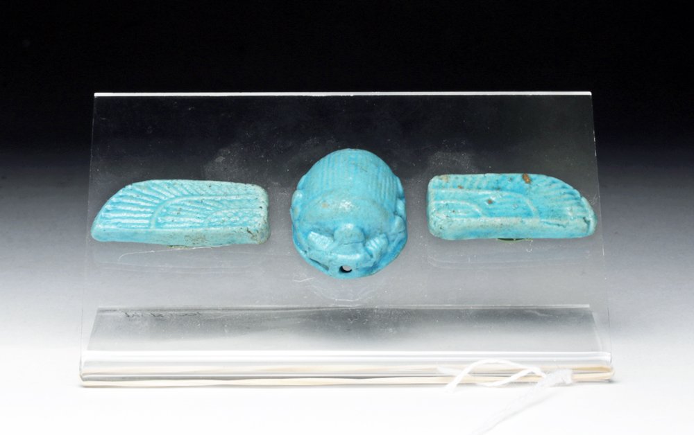 Egyptian Faience Scarab and Wings: Egypt, Late Dynastic Period, Dynasties 26 through 30, Ca 662 to 315 BCE. Stunning faience scarab and matching wings. Each in sky blue faience with nicely detailed surfaces and designed to be sewn