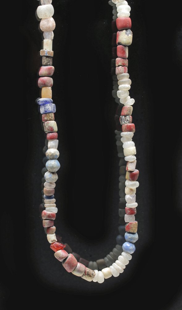 Exceptional Viking Beaded Necklace: Russia, St. Petersburg Viking Age Site in town called Starya Lagoda, ca. 760-1100 CE. Attractive Viking jewelry, this necklace is comprised of stone, glass, and paste beads - some nearly translucent,