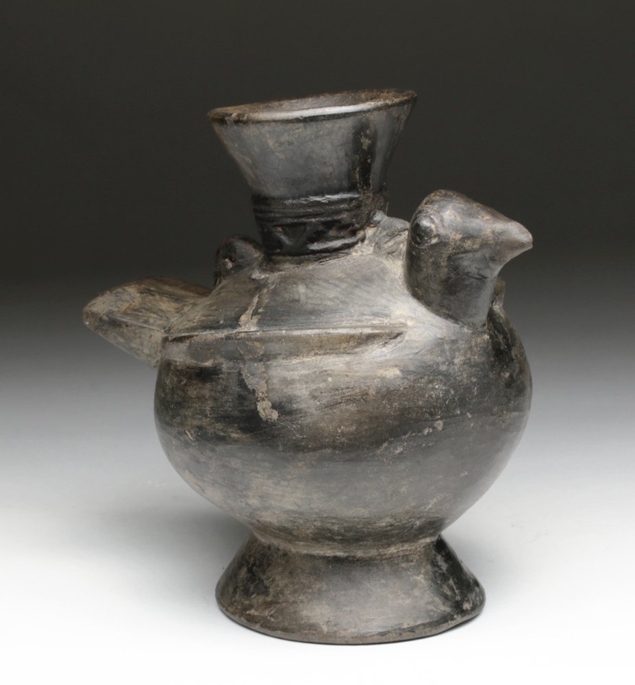 Chimu Bird Blackware Jar, Bird Form: Pre-Columbian, Northern Peru, Chimu culture, ca. 1300-1400 CE. Beautiful mold-made blackware bottle in form of bird, with head, wings, and tail modeled on body. At base of spout is a narrow band wit