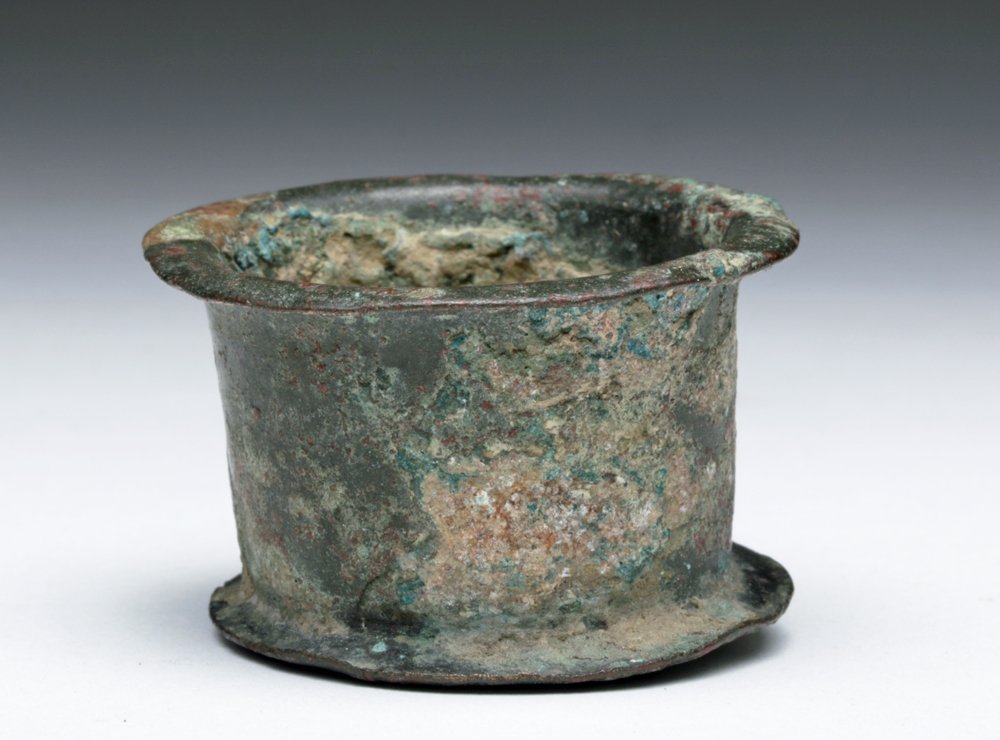 Roman Bronze Cup / Pyxis: Roman Empire, ca 2nd to 3rd centuries CE. Unusual spindle shaped bronze cup, possibly part of a 2-piece pyxis. Flared foot and rim, body slightly flared. 1-1/4" H x 1-7/8" D. Provenance: Ex-private An