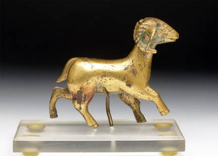 Chinese Gilded Bronze Ram - Ordos Period: Northern China, Mongolia, Ca 3rd to 1st century BCE. Superb gilded bronze ram. Sown in running stance with long curled horns to each side with ears falling just inside the tips of the horns, cloven ho