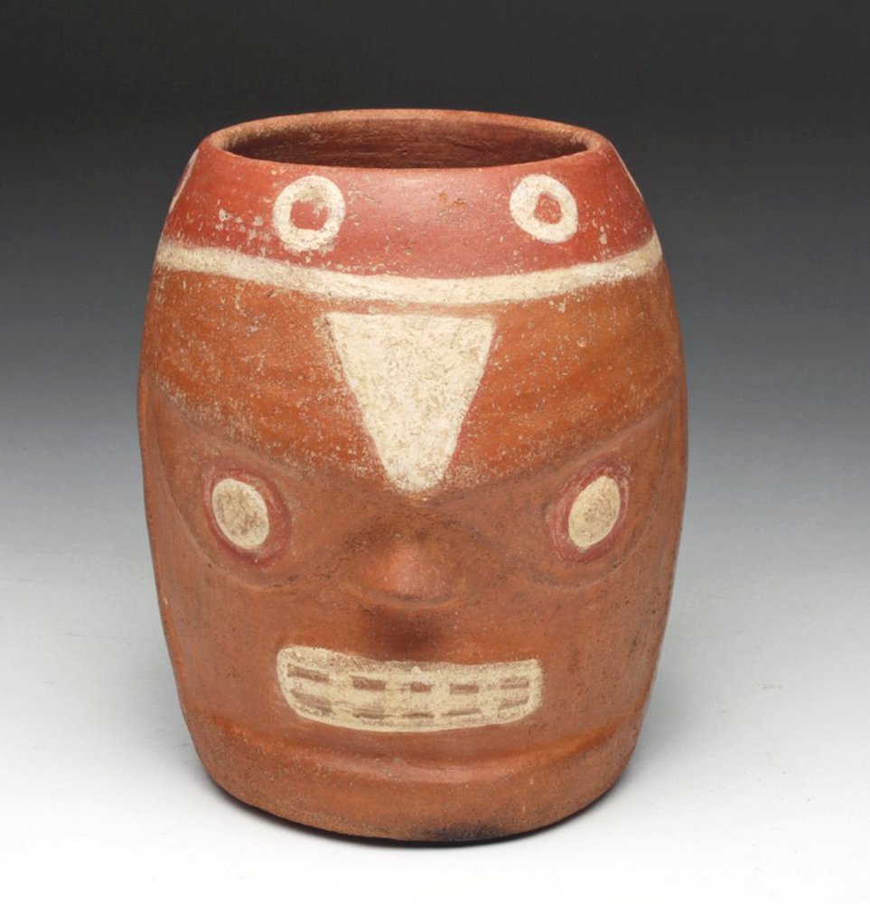 Wari / Huari Face Vessel, Ex-Arte Primitivo: Pre-Columbian, Peru, Wari / Huari culture, ca. 500-1000 CE. This face vessel of burnished redware represents a deity's or shaman's head with bulging eyes and prominent teeth painted in white slip on r