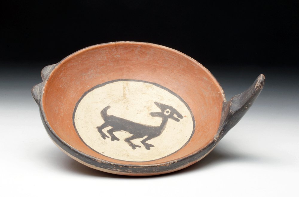 Inca Polychrome Ladle - Camelid Motif: Pre-Columbian, Peru, Inca culture, ca. 1300-1500CE. Marvelous ceramic ladle featuring a central panel decorated with a lively camelid painted in chocolate brown on cream ground. Hues of orange surroun