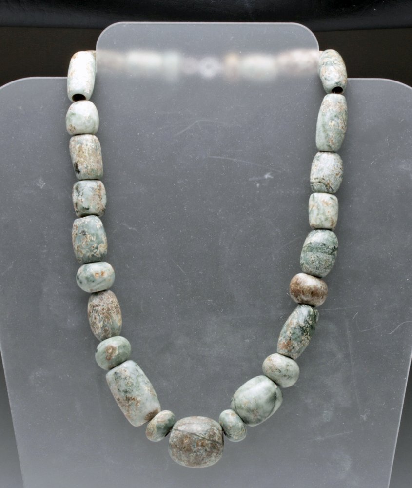 Pre-Columbian Guerrero Green Stone Bead Necklace: Pre-Columbian, from Southern Mexico, Guerrero, Ca 500 BC. Nice long strand of variegated stone beads, perhaps varieties of diorite, metadiorite, and porphyry, all in breathtaking shades of pale green 