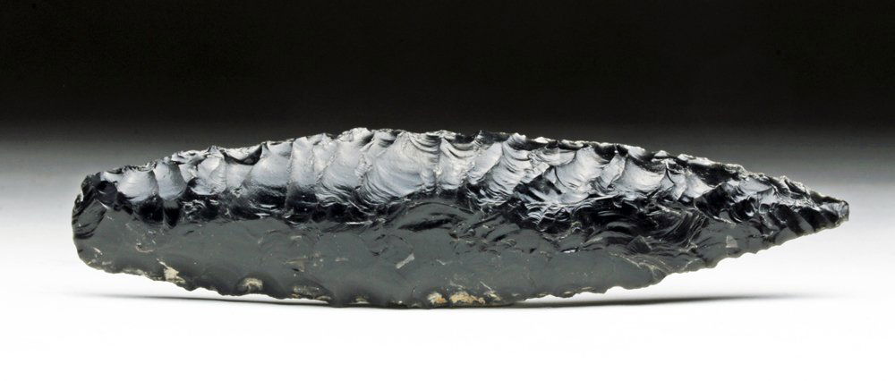 San Juan County, Utah Obsidian Point: Native America, Utah, San Juan County. Lovely deep black obsidian spear point of elongated form and extensively knapped. 4-1/2" L. Provenance: Ex-private Cason collection All items legal to buy/sell