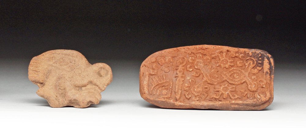 Lot of 2 Mayan + Aztec Terracotta Sellos (Stamps): Mexico, southern Mayan territories and central Mexico, Ca 550 to 1450 CE. Lovely and choice pair of pottery sellos (stamps) used in decorating textiles and bodies. First is a choice Mayan example in t